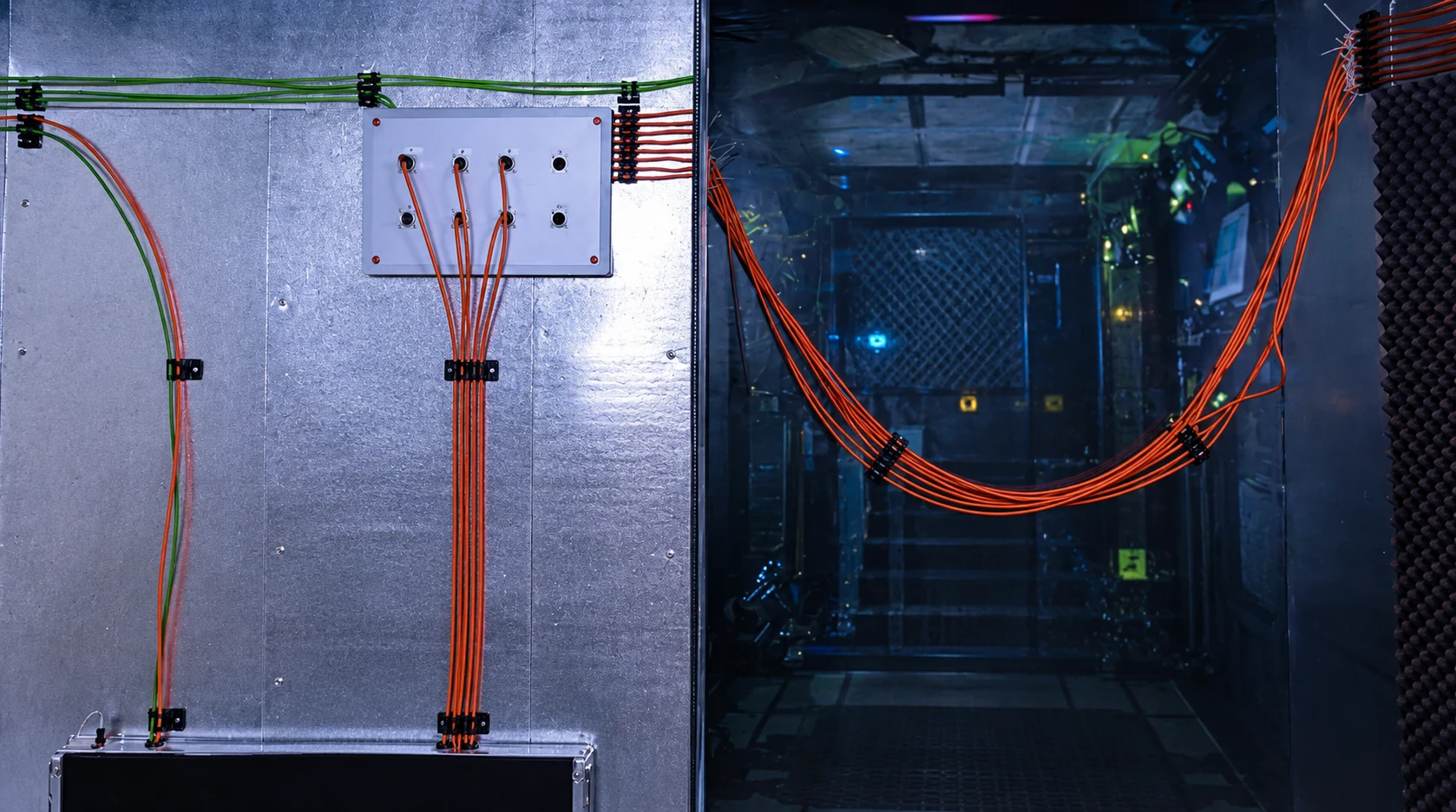 Glass wall with cables and technical elements